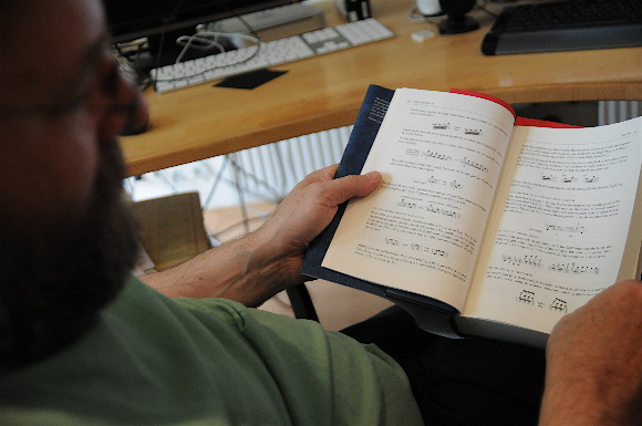 Werner Schweer reading the Behind Bars book